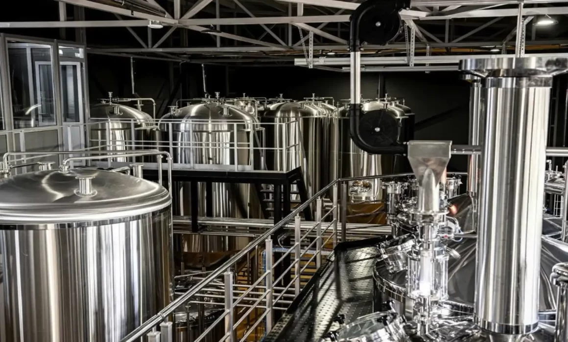 Modern tunnel pasteurizer system in professional brewery facility