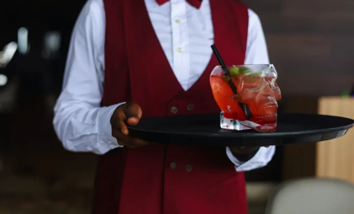 Image of waiter serving hot honey and chili beverage using pasteurization by PRO Engineering / Manufacturing Inc.